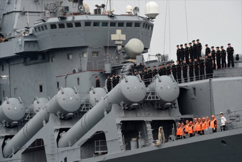 Russian sailors of the missile cruiser Varyag stand next to the missile launch pad as the vessel arrives at the international port of Cam Ranh Bay on April 27.