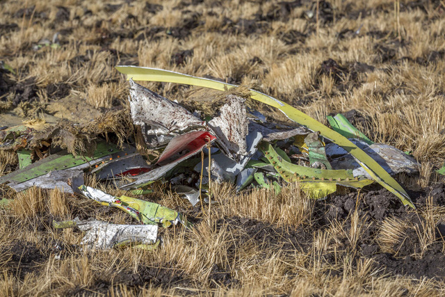 
Parts of the plane wreckage at Bishoftu, or Debre Zeit, outside Addis Ababa, Ethiopia, Monday, March 11, 2019, where Ethiopia Airlines Flight 302 crashed Sunday. Investigators are trying to determine the cause of a deadly crash Sunday involving a new aircraft model touted for its environmentally friendly engine that is used by many airlines worldwide. (AP Photo/Mulugeta Ayene)
