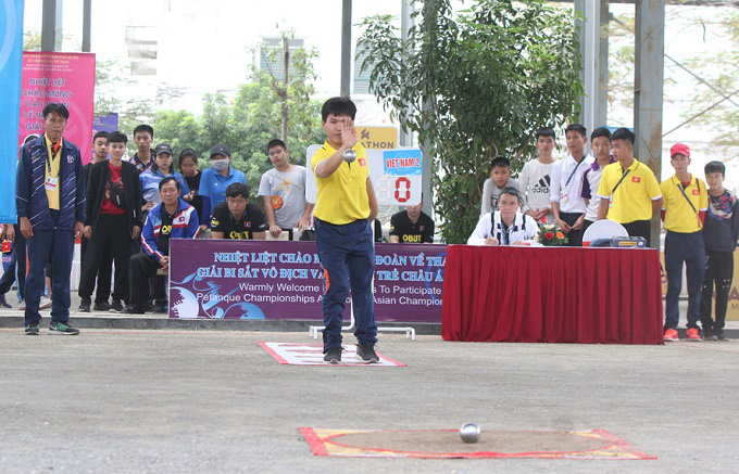 
A Vietnamese petanque player in action at the 2019 Asian Championships. 

