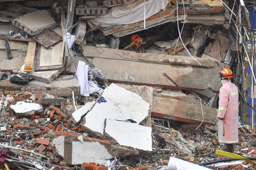 Trung Quốc bắt giữ 9 người liên quan đến vụ sập tòa nhà 6 tầng - Ảnh 2.