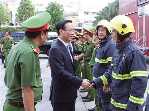 President pays pre-Tet visit to HCM City - Ảnh 1.