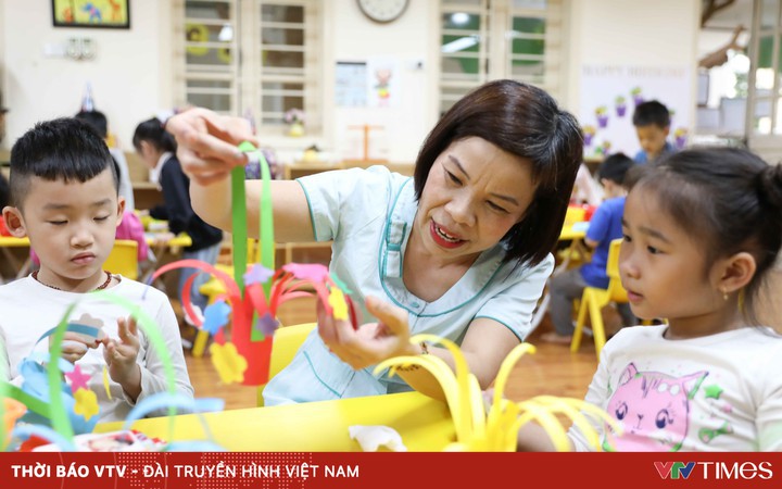 Kindergarten teacher in Hanoi excitedly cleans, looking forward to welcoming the children back