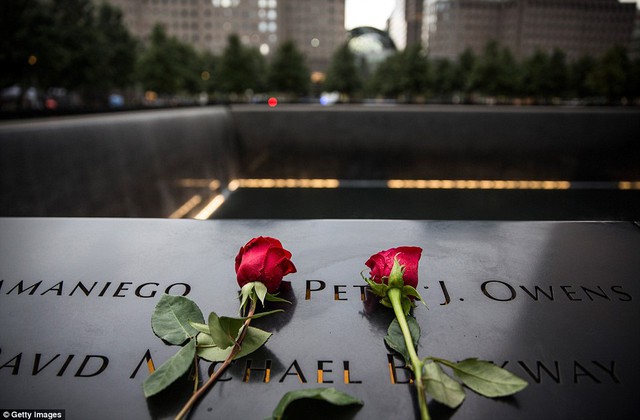 Flowers are laid at the 9/11 memorial site on September 11, 2015 in New York City. Today marks the 14th anniversary of the attacks where nearly 3,000 people were killed in New York, Washington DC and Pennsylvania
