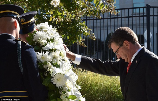 US Secretary of Defense Ash Carter places a wreath at the National 9/11 Pentagon Memorial on September 11, 2015, on the 14th anniversary of the 911 attacks