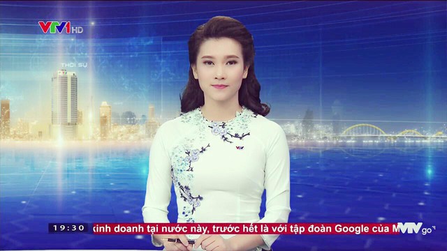 BTV Khánh Trang với những chiếc áo dài gây thương nhớ trong Bản tin 19h - Ảnh 2.