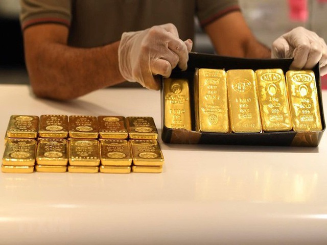Giá vàng tuột mốc 57 triệu đồng/lượng - Ảnh 1.