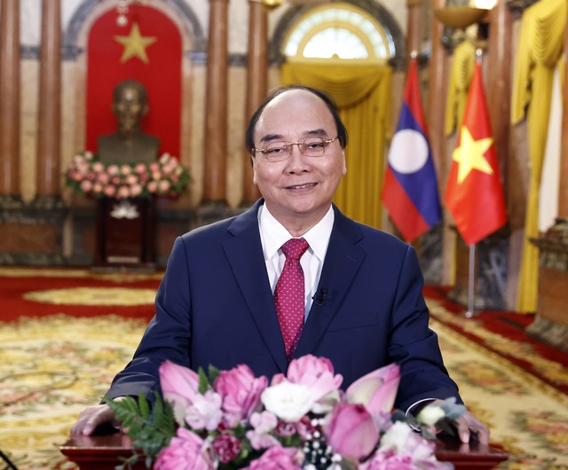 Chủ tịch nước: Mối quan hệ Việt Nam - Lào sẽ tiếp tục nở hoa thơm, kết trái ngọt - Ảnh 1.