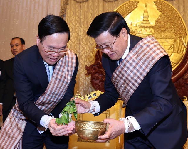 Chủ tịch nước Võ Văn Thưởng dự Lễ buộc chỉ cổ tay tại Lào - Ảnh 4.