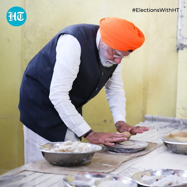 Thủ tướng Ấn Độ đích thân phục vụ bữa ăn cho người dân - Ảnh 2.