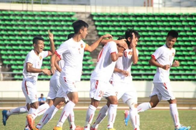 Winning start: Vietnamese players celebrate after scoring a goal in their 2-0 win over East Timor at the ASEAN Football Federation's U19 Championship in Laos. — Photo vnexpress.net