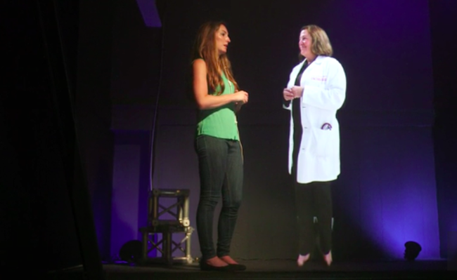 Leslie Saxon talking to a patient via hologram