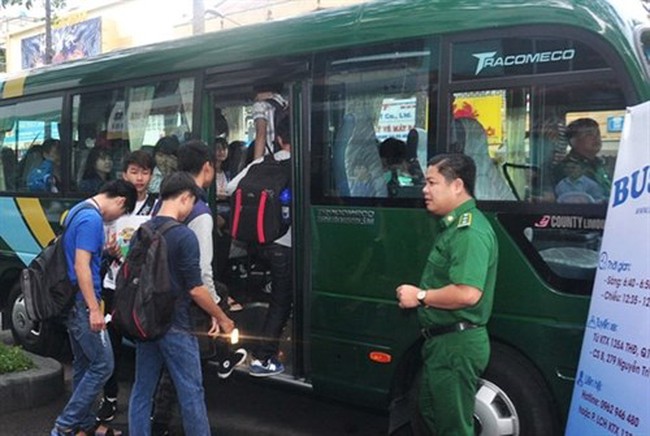 Students board a school bus in HCM City. (Photo: VNA)