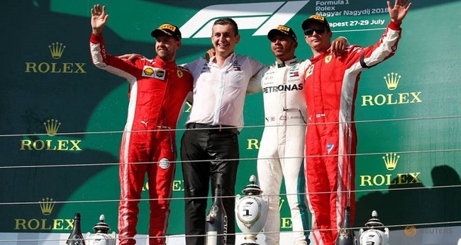 Mercedes’ Lewis Hamilton celebrates on the podium after winning the race alongside second placed Ferrari’s Sebastian Vettel and third placed Ferrari’s Kimi Raikkonen. (Photo: Reuters)