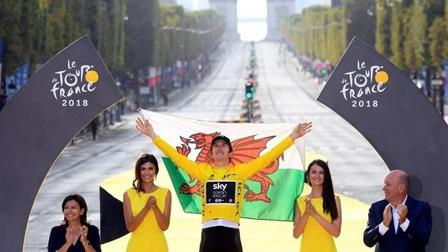 Team Sky rider Geraint Thomas of Britain celebrates his overall win on the Tour de France podium. (Photo: Reuters)