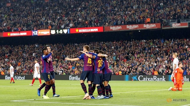 Barcelona's Lionel Messi celebrates scoring their second goal with team mates. (Reuters)