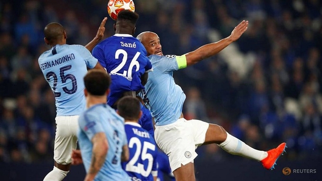 Schalke's Salif Sane in action with Manchester City's Vincent Kompany and Fernandinho. (Reuters)