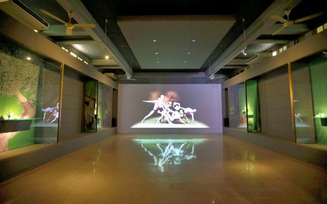 The exhibition combines product displays with sound and lighting effects.