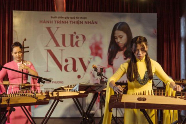 Minh Phuong (in yellow) performs at the concert 'Now and then'