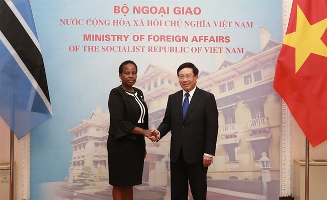 Deputy Prime Minister and Foreign Minister Phạm Bình Minh (right) holds talks with Minister of Foreign Affairs and International Cooperation of Botswana Unity Dow in Hà Nội on Monday