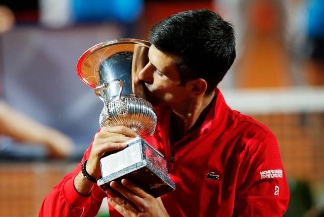 Novak Djokovic celebrates his fifth Italian Open trophy. (Reuters)