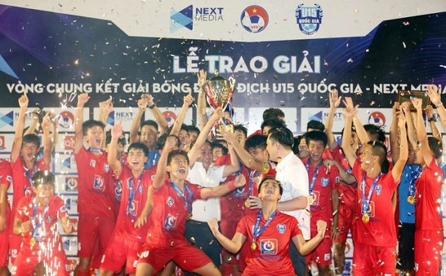 PVF players celebrate their championship trophy.