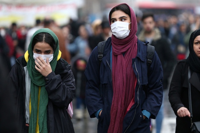 Iranian women wear protective masks to prevent contracting a coronavirus, as they walk at Grand Bazaar in Tehran (Photo: WANA (West Asia News Agency)/Nazanin Tabatabaee via REUTERS)