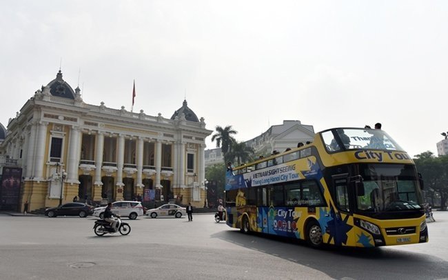 Double decker bus city tour service takes visitors around Hanoi. Photo: DANG ANH