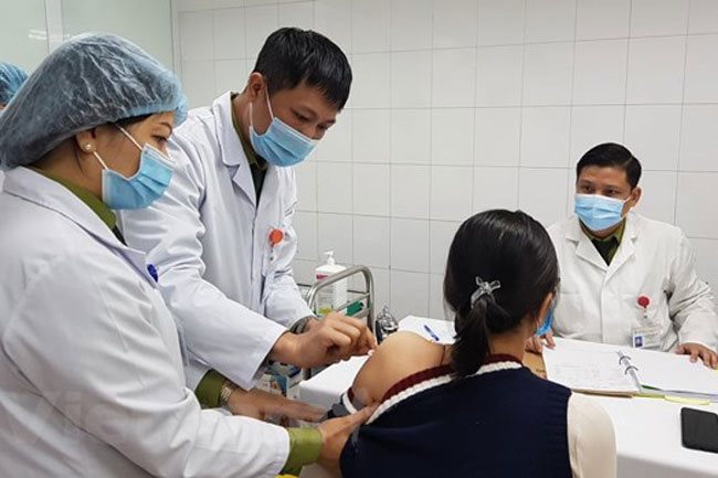 A woman is injected with Vietnam’s Covid-19 vaccine with the highest dosage of 75 micrograms – PHOTO: VIETNAMPLUS