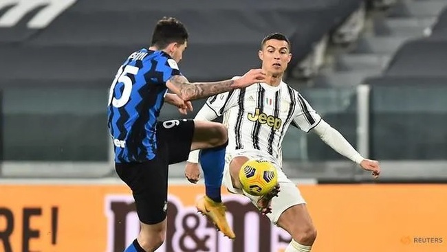 Juventus' Cristiano Ronaldo in action with Inter Milan's Alessandro Bastoni. (Reuters)
