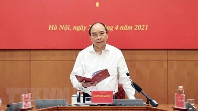 President Nguyen Xuan Phuc speaks at the meeting. (Photo: VNA)