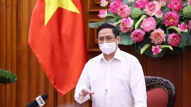 Prime Minister Pham Minh Chinh speaks at the meeting. (Photo: VNA)