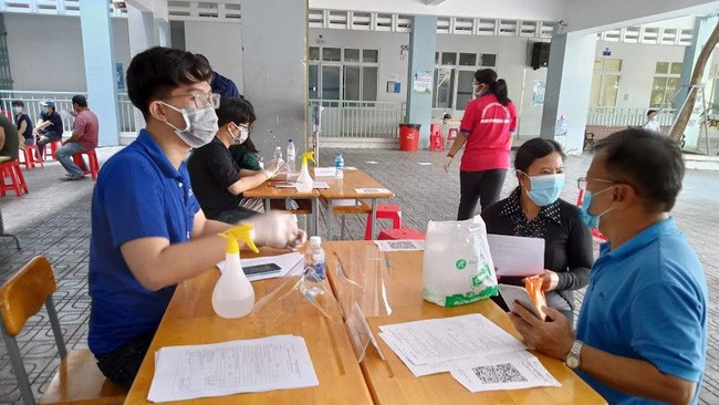 Young volunteers help with the vaccination campaign in Ho Chi Minh City.