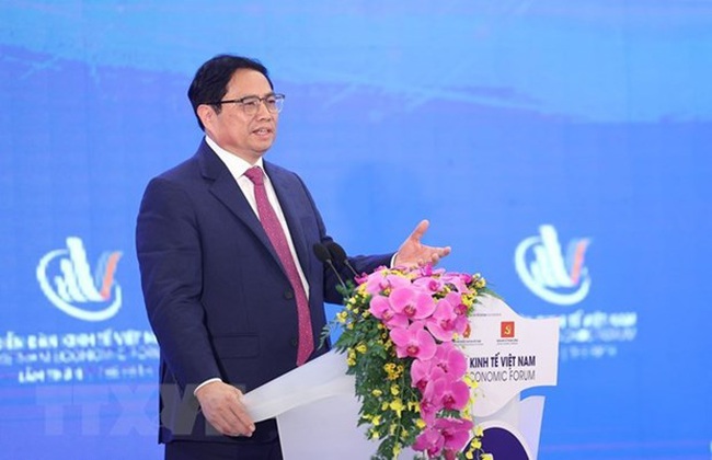 Prime Minister Pham Minh Chinh addresses the forum. (Photo: VNA)