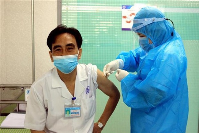 A man recieves COVID-19 vaccine shot in Thai Binh during Tet, Vietnam's traditional New Year holiday. (Photo: VNA)