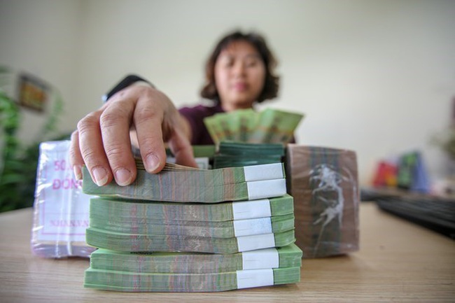 The State Bank of Vietnam set the daily reference exchange rate for the US dollar at 23,135 VND/USD on May 9. (Photo: VNA)
