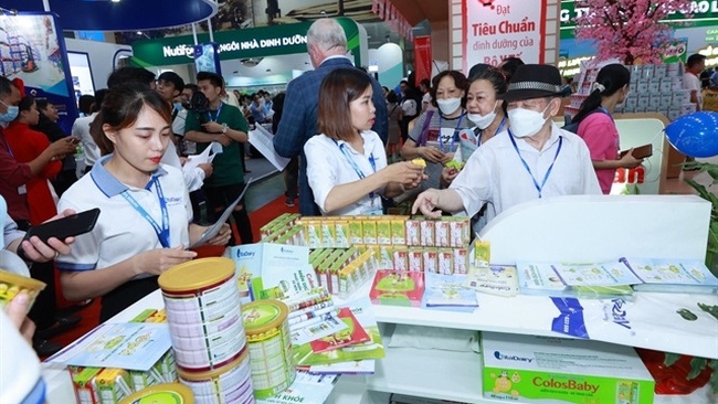 Visitors at the Vietnam Dairy 2022 in Hanoi (Photo: VNA)