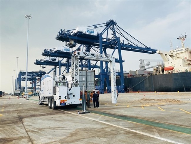 Inspectors examine a container at Cai Lan port in Quang Ninh province. More ports need to be built to promote inter-regional ties. (Photo: VNA)