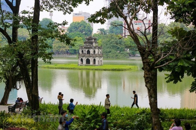 The Turtle Tower on Hoan Kiem Lake, an icon of Hanoi.