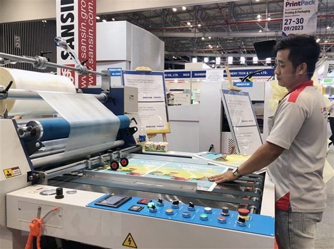 Latest technologies in the printing industry are introduced at the event. (Photo: VNA)