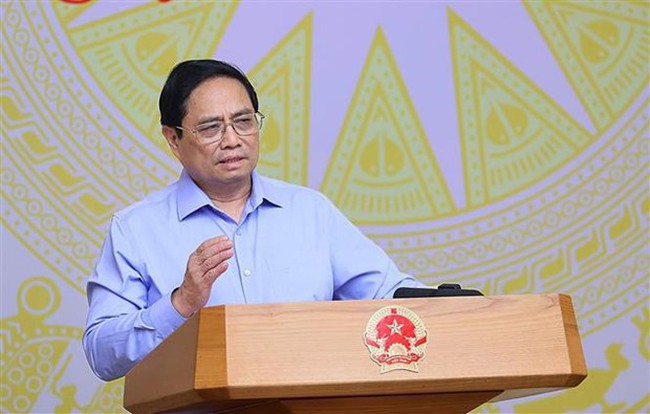 PM Pham Minh Chinh speaks at the hybrid event on July 19. (Photo: VNA)