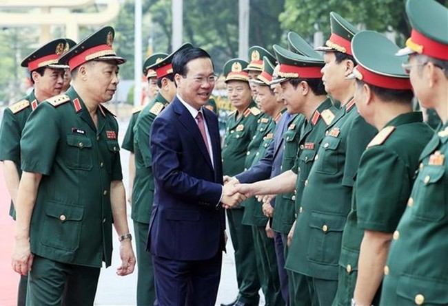 President Vo Van Thuong is welcomed by National Defence Academy staff (Photo: VNA)