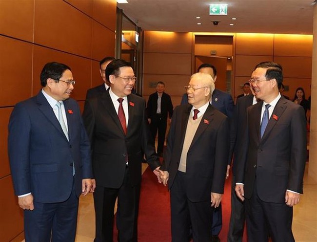 Party General Secretary Nguyen Phu Trong (second, right), State President Vo Van Thuong (first, right), Prime Minister Pham Minh Chinh (first, left), and NA Chairman Vuong Dinh Hue attend the 15th NA's fifth extraordinary session. (Photo: VNA)