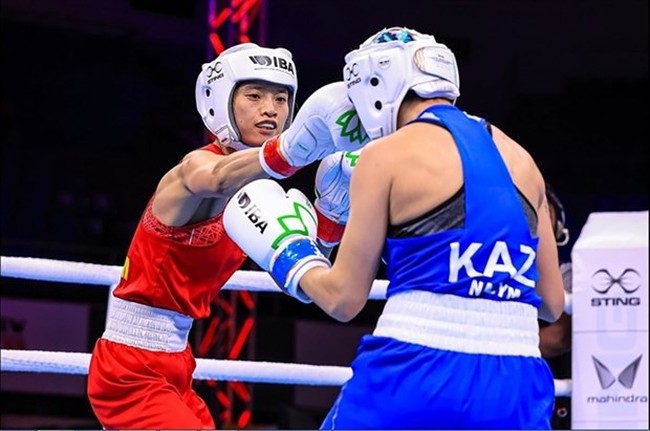 Nguyen Thi Tam (left) is Vietnam's first Olympic boxer. She targets a second turn at the Games in Paris this summer. (Photo of IBA)