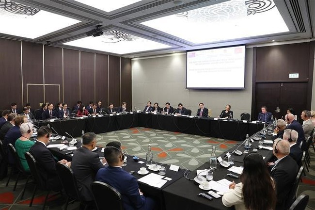 The seminar between PM Pham Minh Chinh and New Zealand businesses in Wellington on March 11. (Photo: VNA)