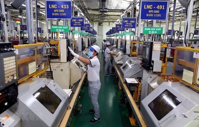 Production at an FDI firm in Tan Thua export processing zone in Ho Chi Minh City (Photo: VNA)