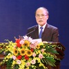 Grand meeting marks Laos’ 40th National Day