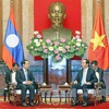 Senior leaders host Lao Foreign Minister