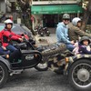 CNN crew explores Hanoi on a sidecar