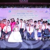 Couples with disabilities tie knot in Hanoi mass wedding