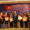 Vietnam, Laos discuss boosting labour, social welfare cooperation